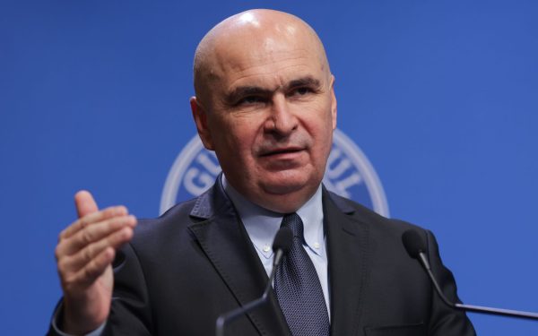 Bolojan taie în carne vie: premierul desființează/comasează companii de stat